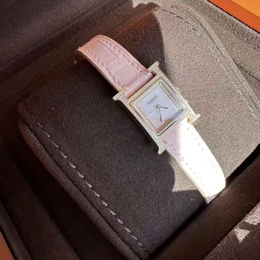 Side angle showing H-shaped bezel detail on Hermes Women Heure H Watch Mini