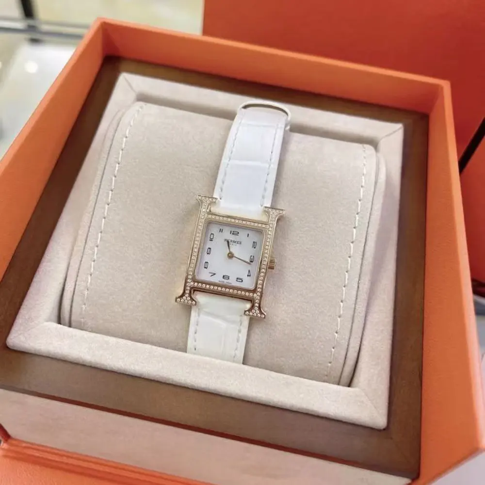Close-up on rose gold case detail of Hermes Women Heure H Watch Mini