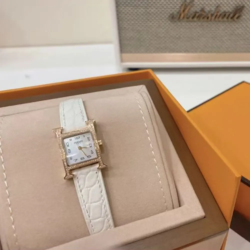 Side profile showing leather strap and clasp of Hermes Women Heure H Watch Mini