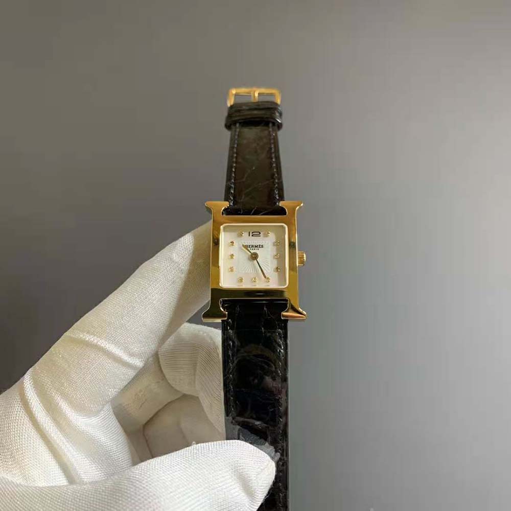 Close-up of signature H-shaped bezel on Hermes Women Heure H Watch Mini Model