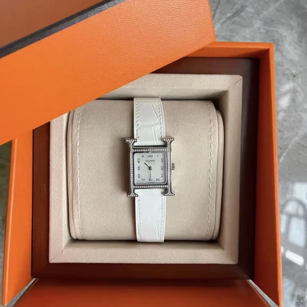 Close-up of signature H-shaped bezel on Hermes Women Heure H Watch