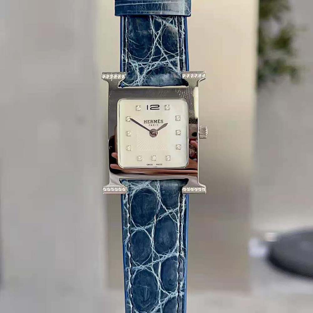 Side profile showing navy leather strap and buckle on Hermes Women Heure H Watch