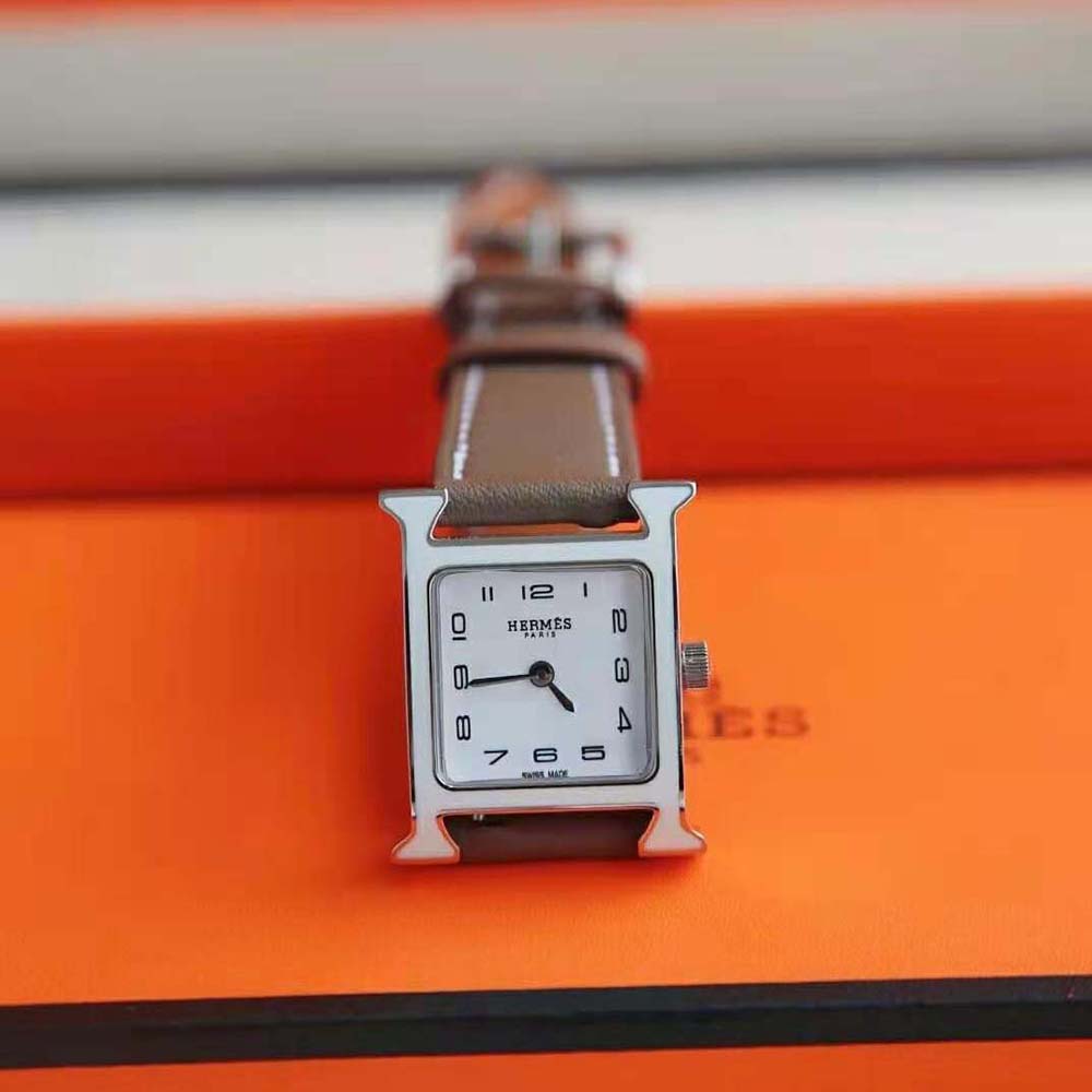 Close-up of gray dial and H-shaped bezel detail on Hermes Heure H Watch