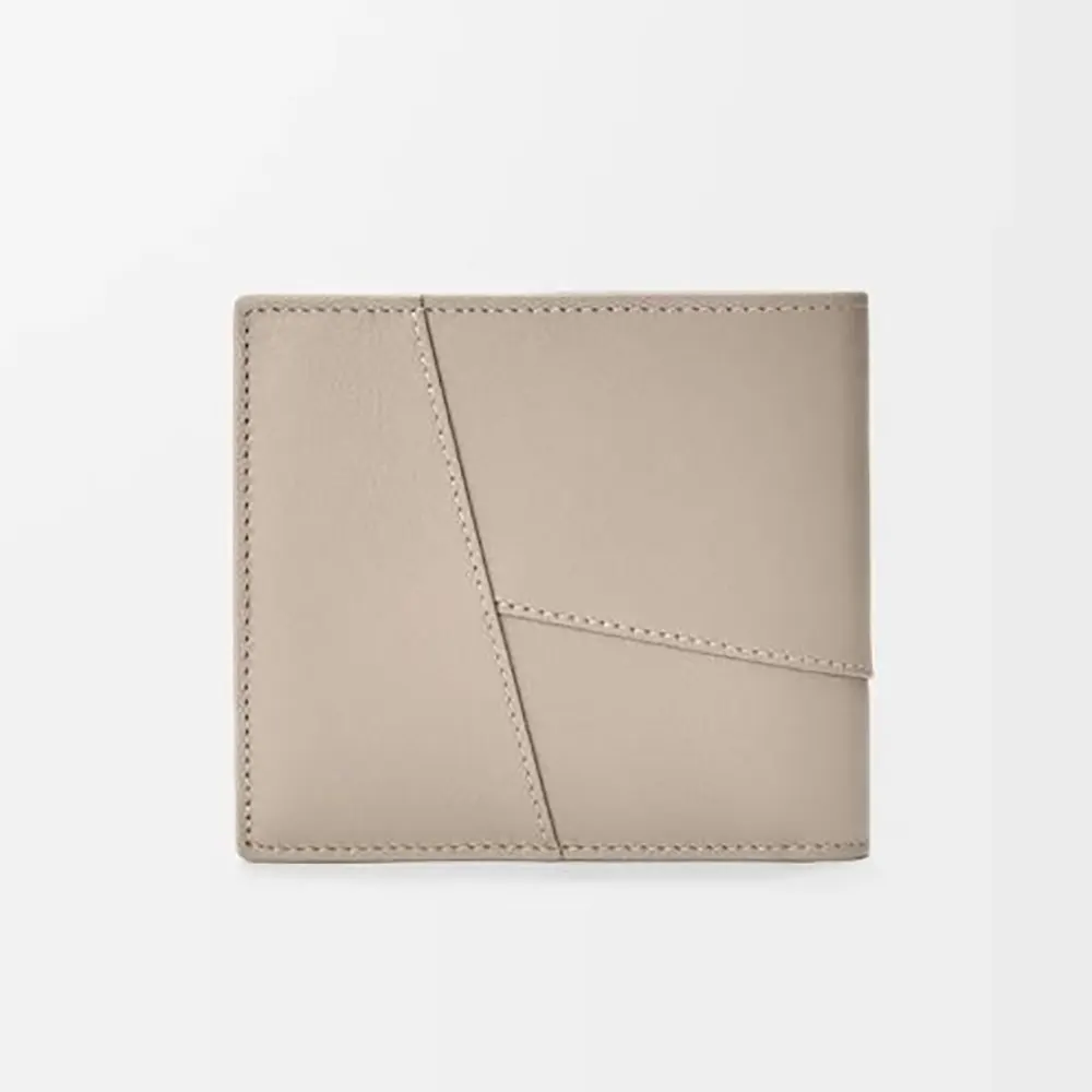 Close-up detail of Loewe puzzle stitch on wallet exterior