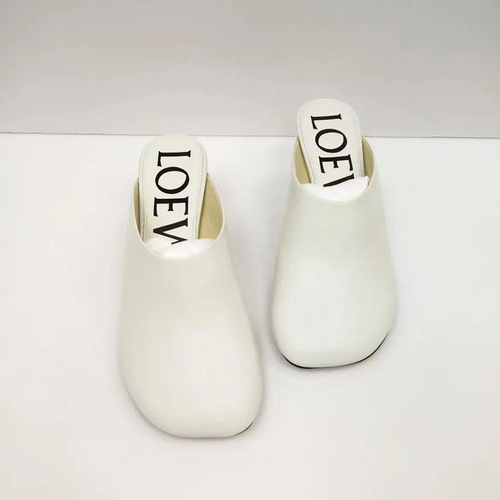 Close-up of white goatskin leather and Loewe logo detail on mule