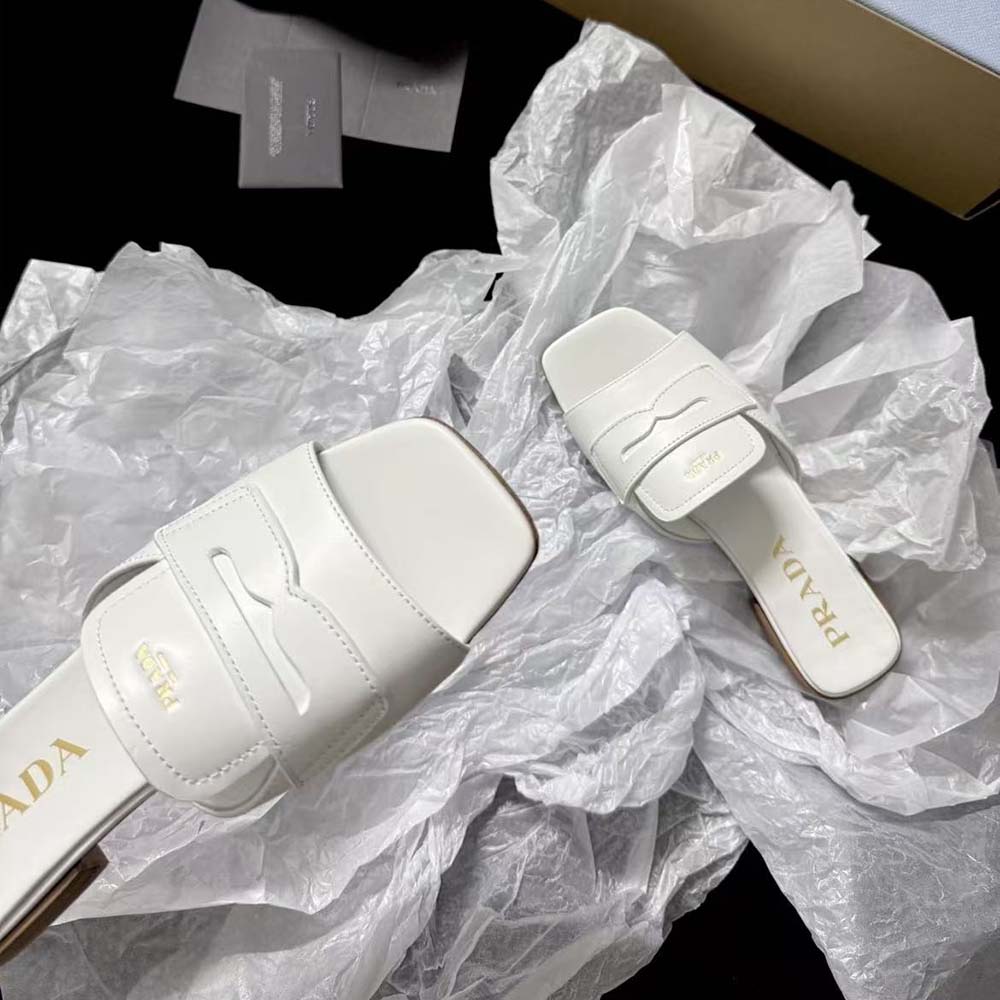 Front angle showing sleek silhouette of Prada Women Leather Sandals-Chalk White