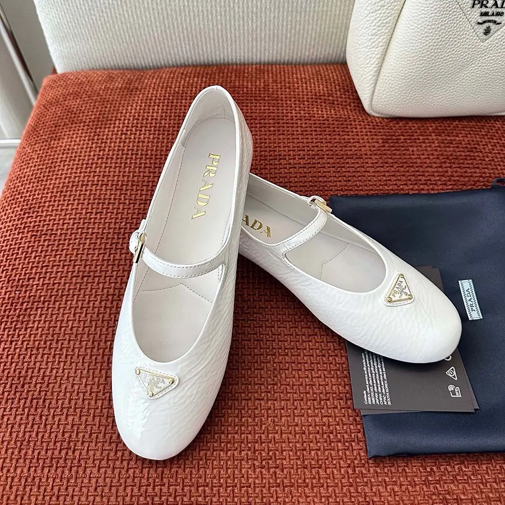 Top-down view of Prada Women Naplak Patent Leather Ballerinas-White highlighting signature detailing
