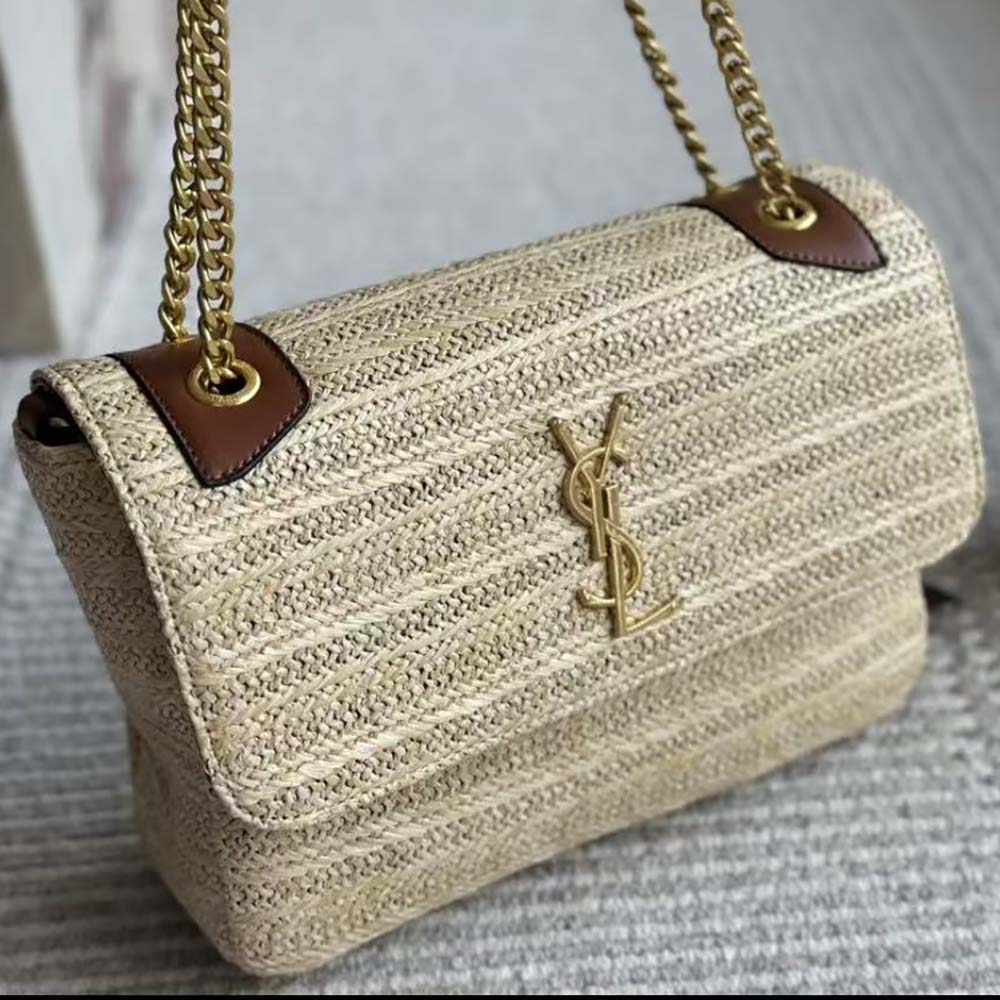 Side angle showing textured raffia and leather flap on Saint Laurent Niki Medium bag