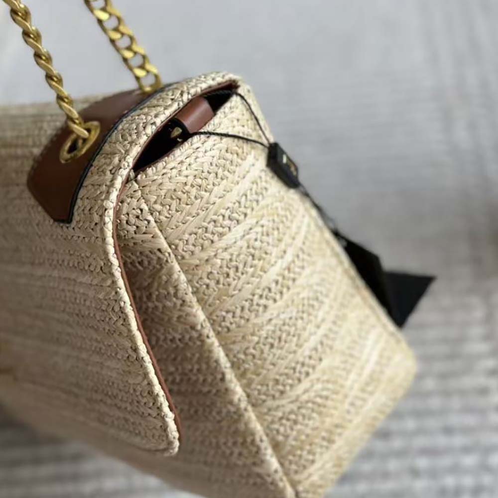 Side angle showing compact silhouette of Saint Laurent YSL Niki Small Bag