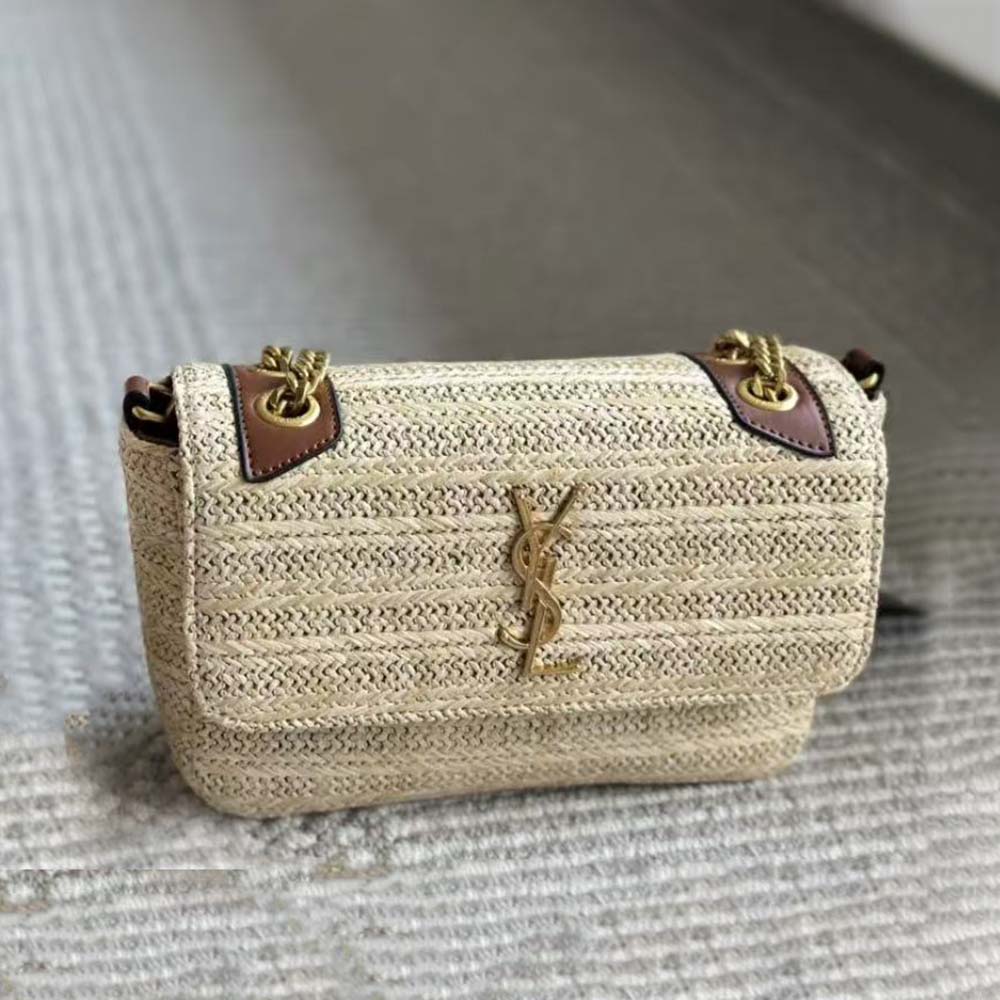 Close-up of gold YSL chain and raffia texture detail