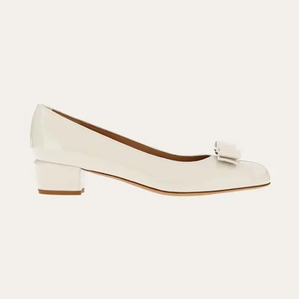 Side profile of Salvatore Ferragamo Women Vara Pump-White showing bow detail