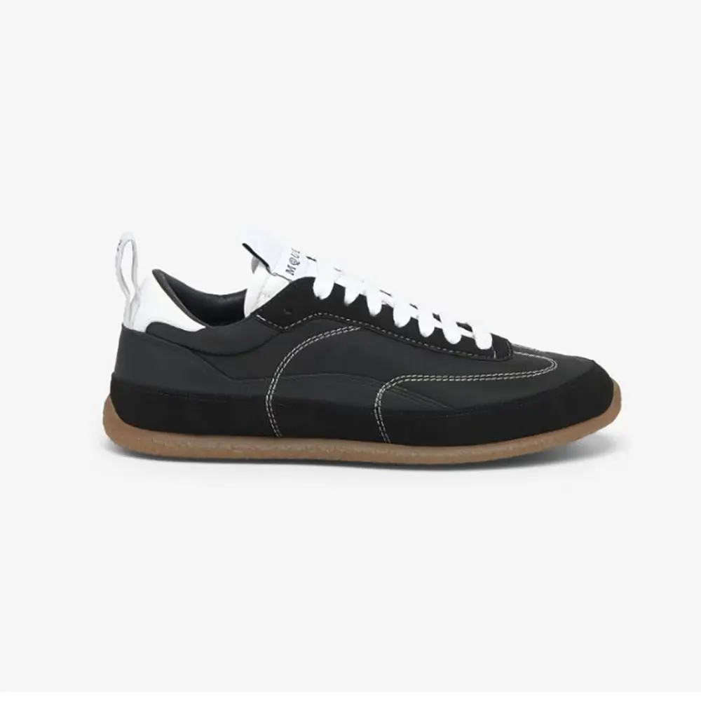 Side profile of Alexander Mcqueen Unisex EC1 Sneaker in black and white