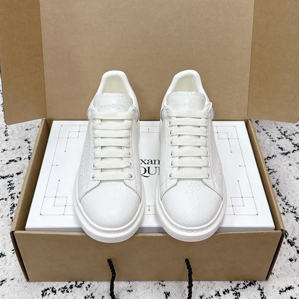 Close-up of white leather and rubber sole on Alexander Mcqueen sneaker