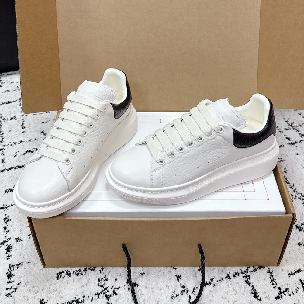Top view showing leather texture and logo on Alexander Mcqueen Unisex Oversized Sneaker