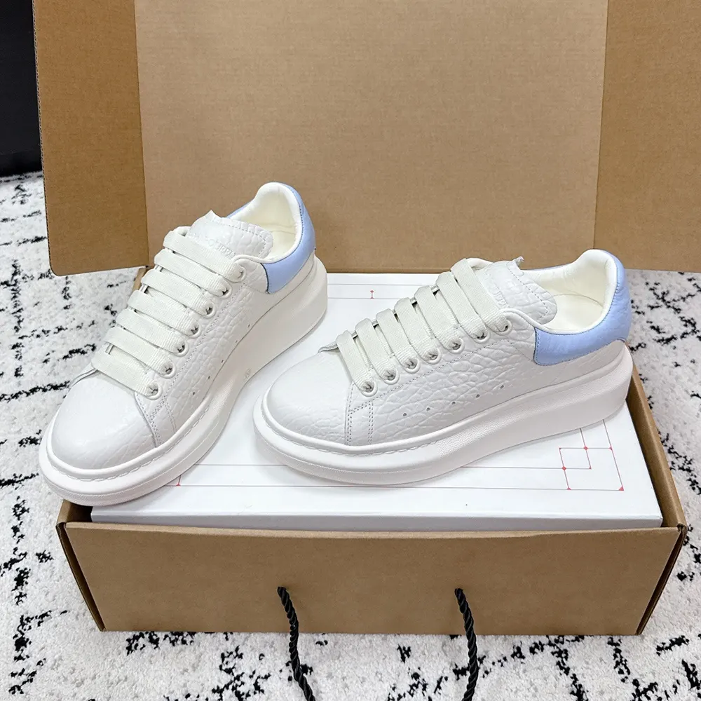Top angle showing signature tongue logo on Alexander Mcqueen Unisex Oversized Sneaker