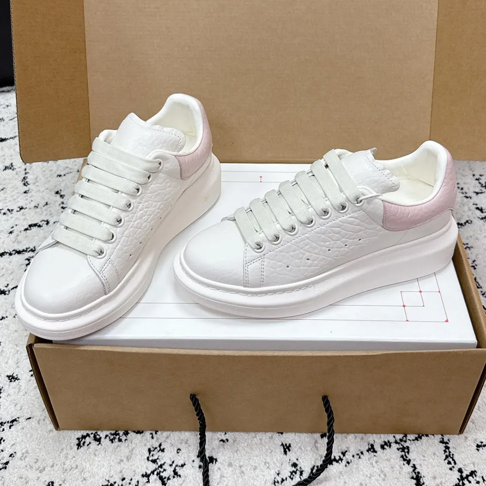 Top view showing lace-up design on Alexander Mcqueen off white pink sneaker