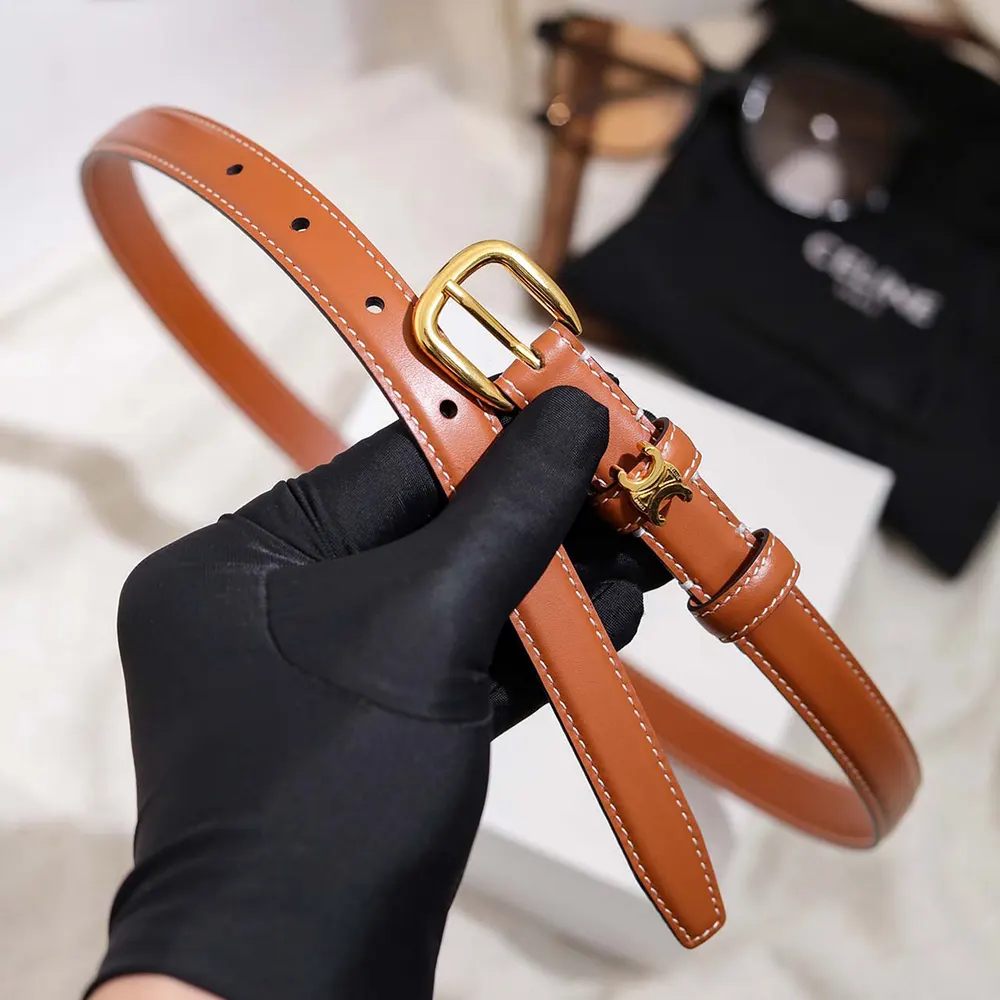 Side angle showing polished finish of Celine Women Vivienne Belt 25Mm In Natural Calfskin-Tan