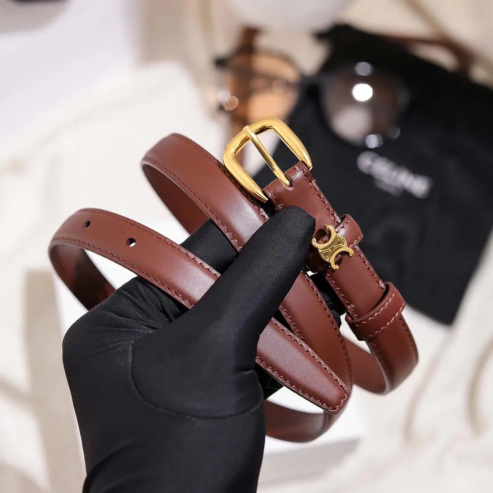 Side angle showing dark brown taurillon leather texture on Celine Women Vivienne Belt