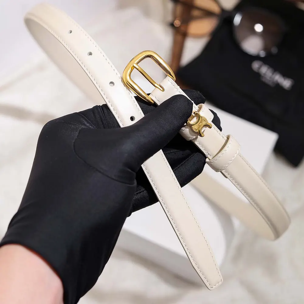 Close-up of gold Vivienne buckle on Celine Women Vivienne Belt 25Mm White