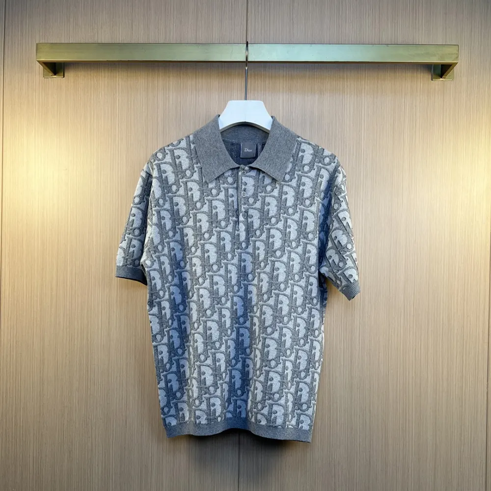 Close-up detail of Dior signature oblique pattern on gray polo shirt