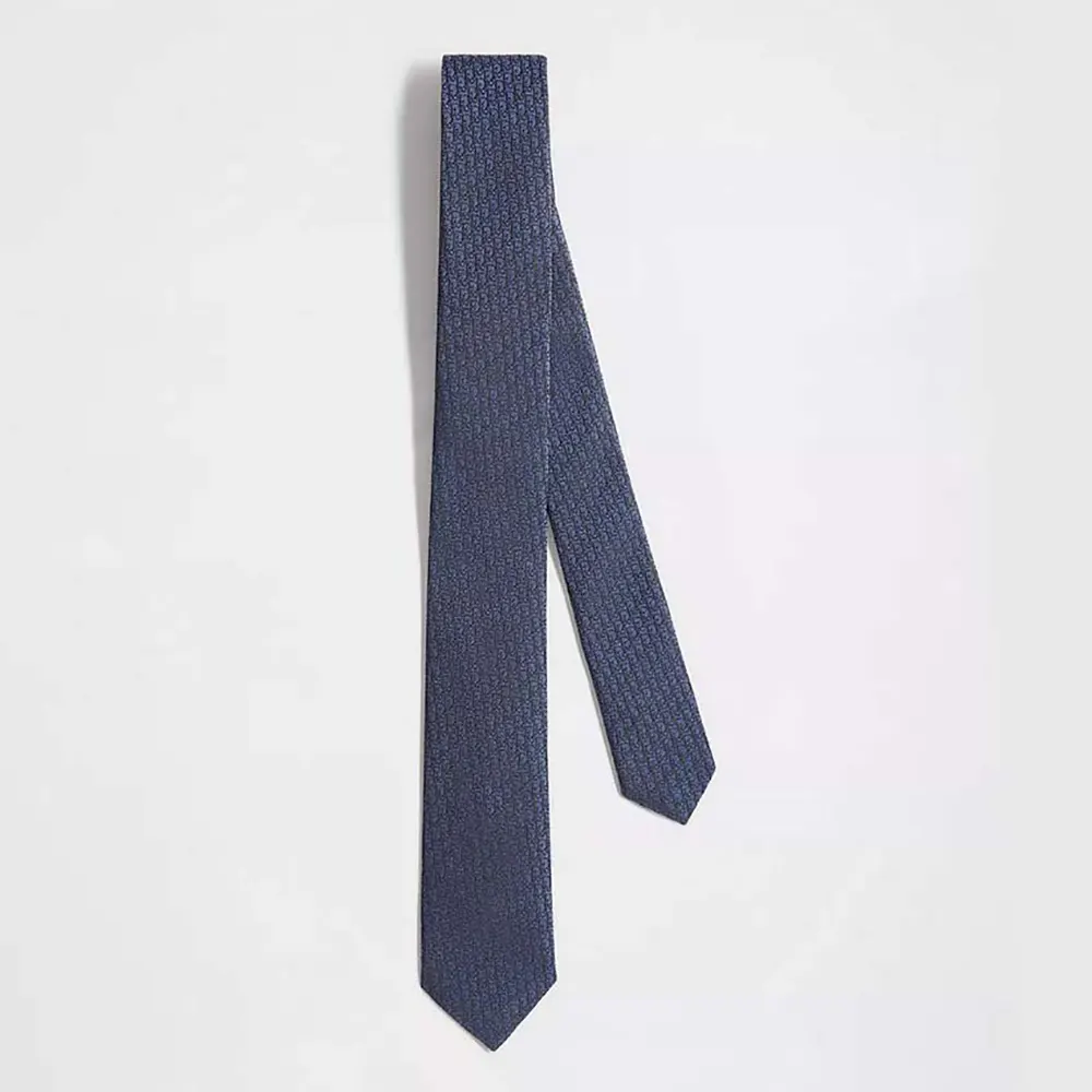 Front angle of Dior Men Oblique Tie Blue and Black Silk showing pattern