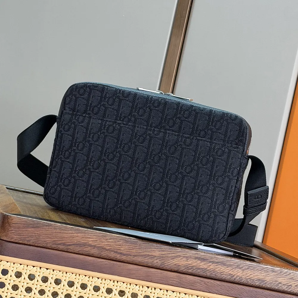 Side profile showing adjustable strap of Dior Men Rider Zipped Messenger Bag Black