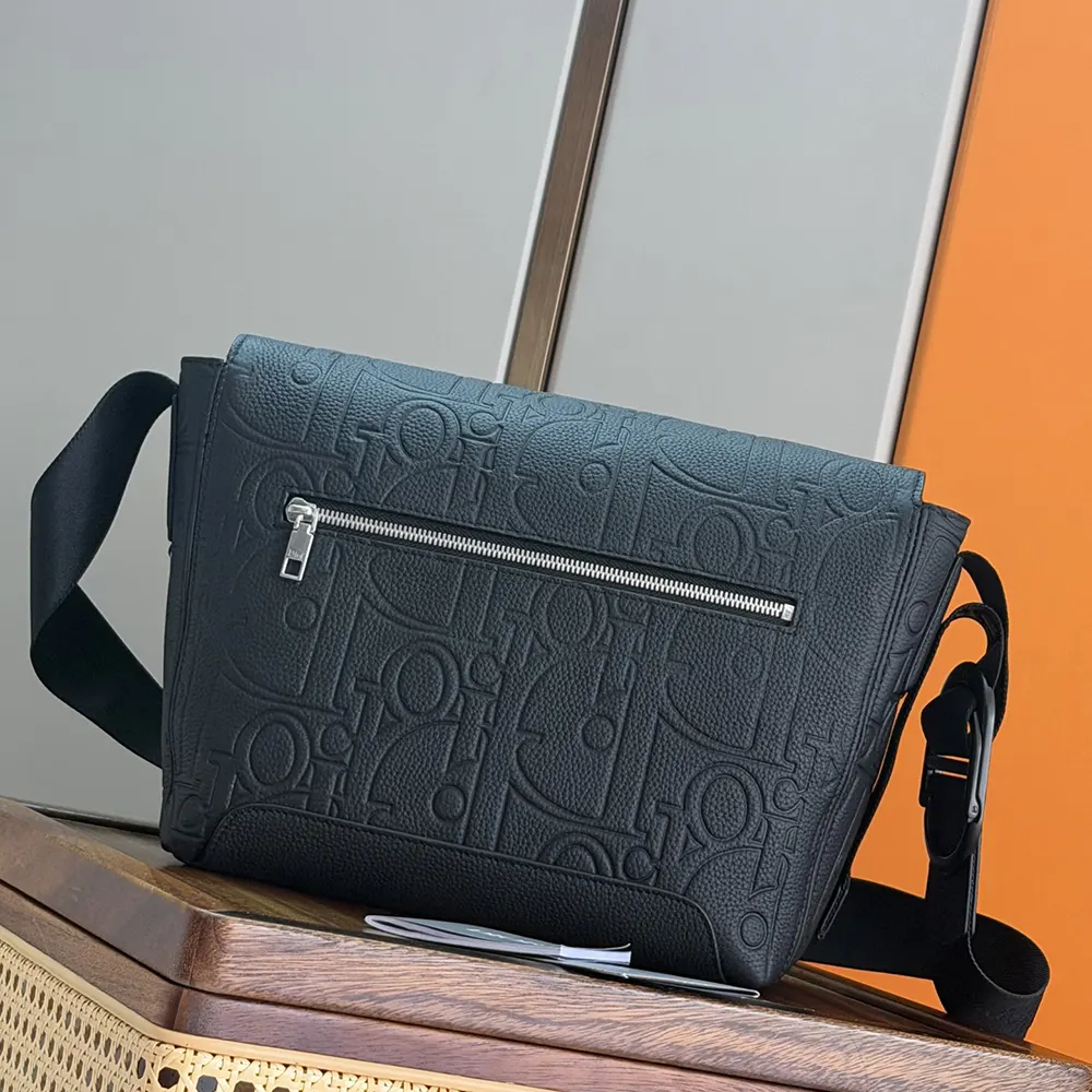 Side angle showing adjustable strap on Dior Men Small Dior Jett Messenger Bag