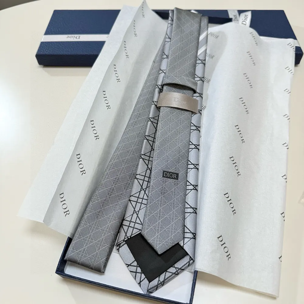 Side angle showing texture and silk shine of Dior Men Striped Cannage Tie