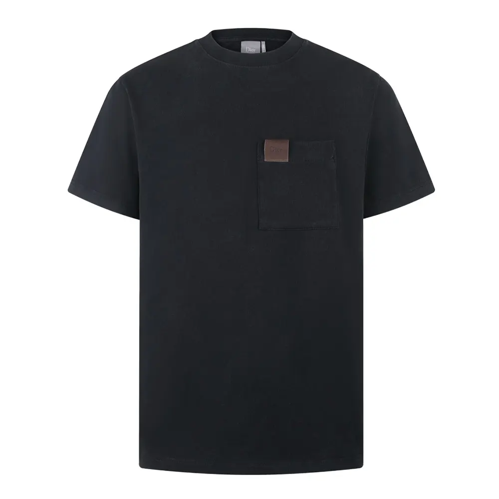 Close-up of Dior embroidery detail on black and white t-shirt