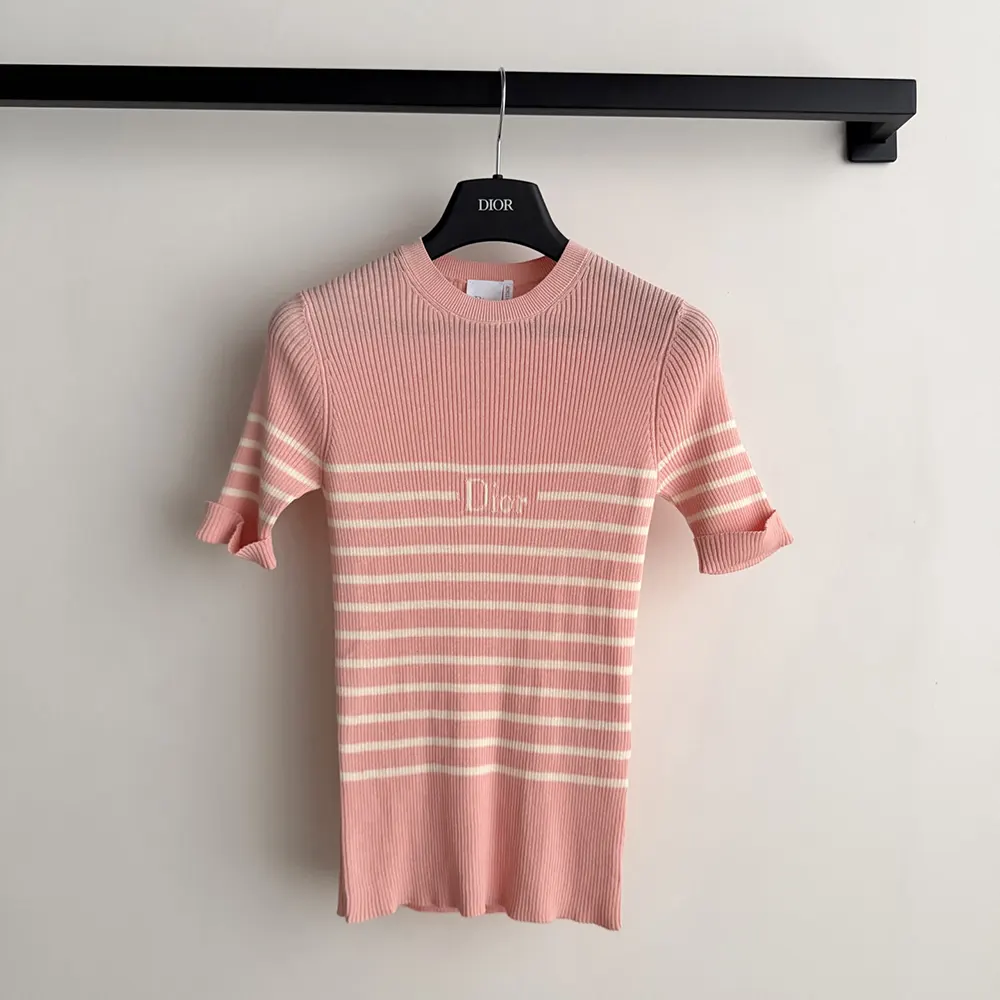 Close-up on pink and white D-stripes of Dioriviera ribbed cotton knit