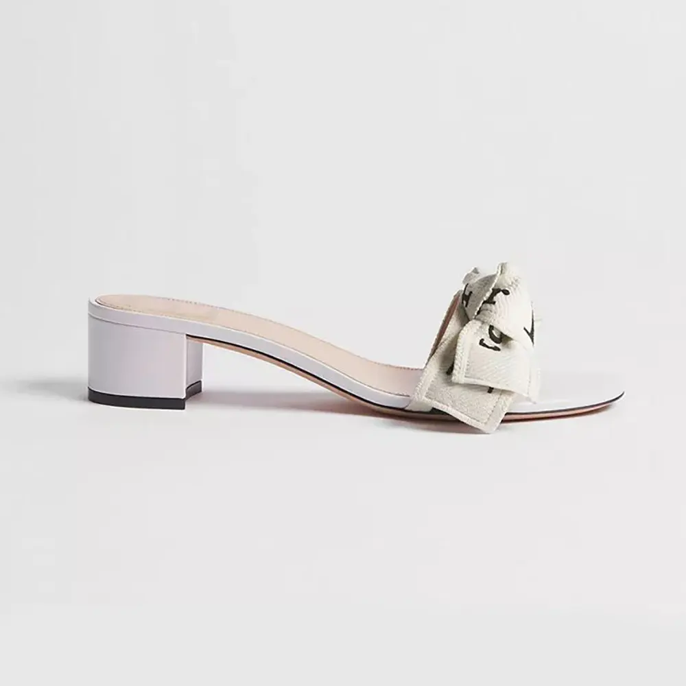 Front angle of Dior Women J’Adior Heeled Slide Ivory Embroidered Cotton