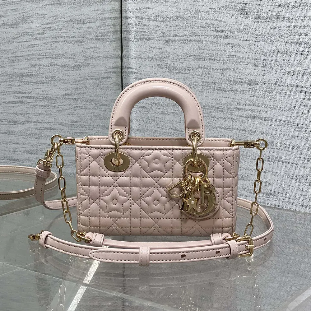 Side angle showcasing compact shape and chain strap of the Dior micro bag