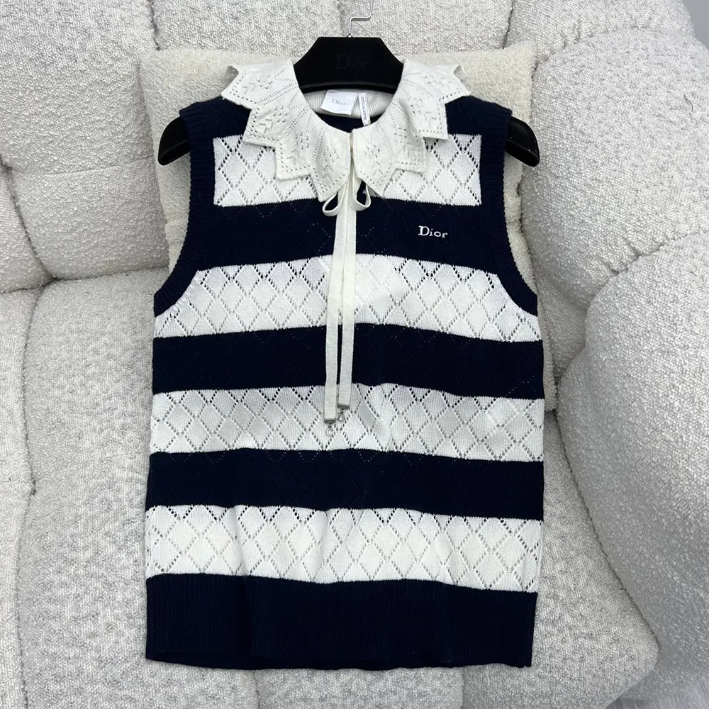 Close-up of openwork cashmere knit detail on Dior sweater vest