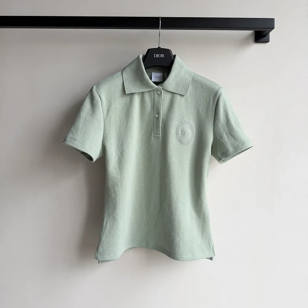 Close-up of Médaillon embroidery on green Dior Women polo shirt