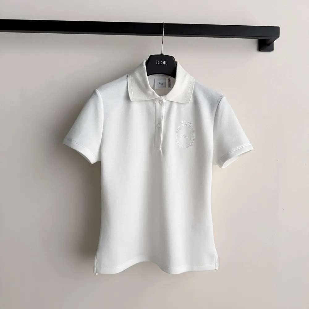 Close-up of embroidered Médaillon detail on Dior Women polo shirt
