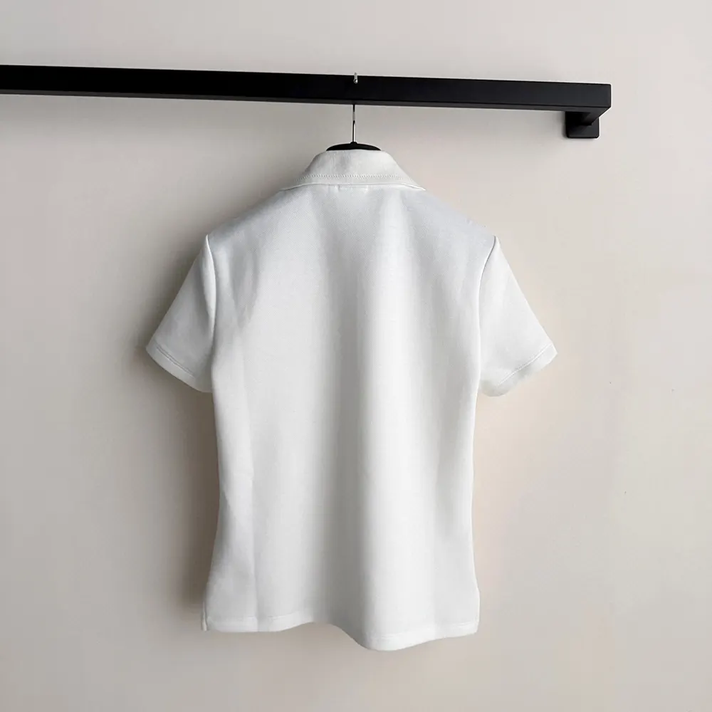 Side profile highlighting silhouette of Dior Women Médaillon Polo Shirt
