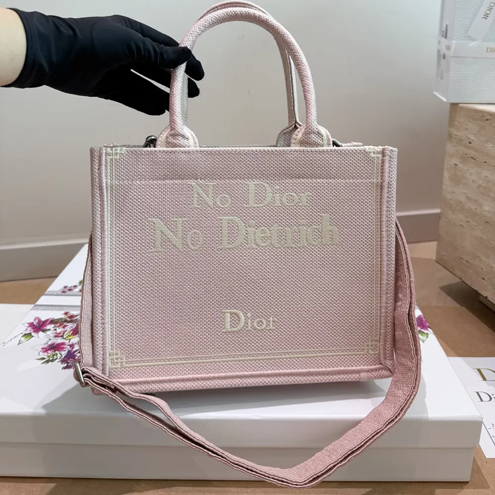 Close-up detail of No Dior No Dietrich embroidery on pink tote