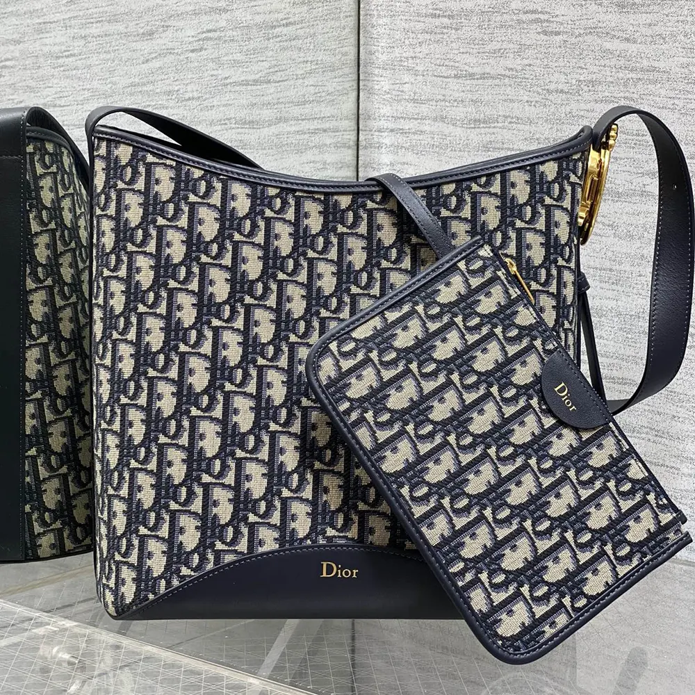 Close-up of silver Médaillon hardware on Dior Women Medium Dior Médaillon Bucket Bag
