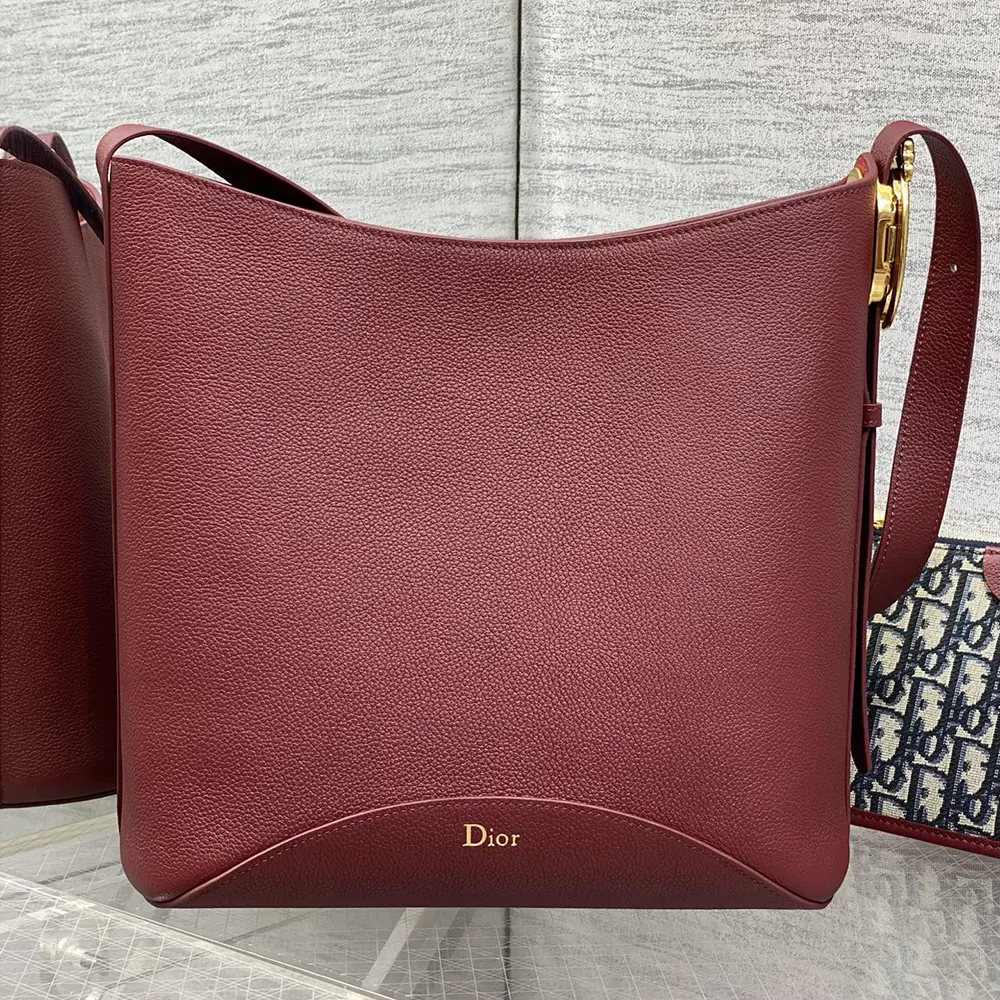 Side angle showing drawstring closure on Dior Women Medium Dior Médaillon Bucket Bag