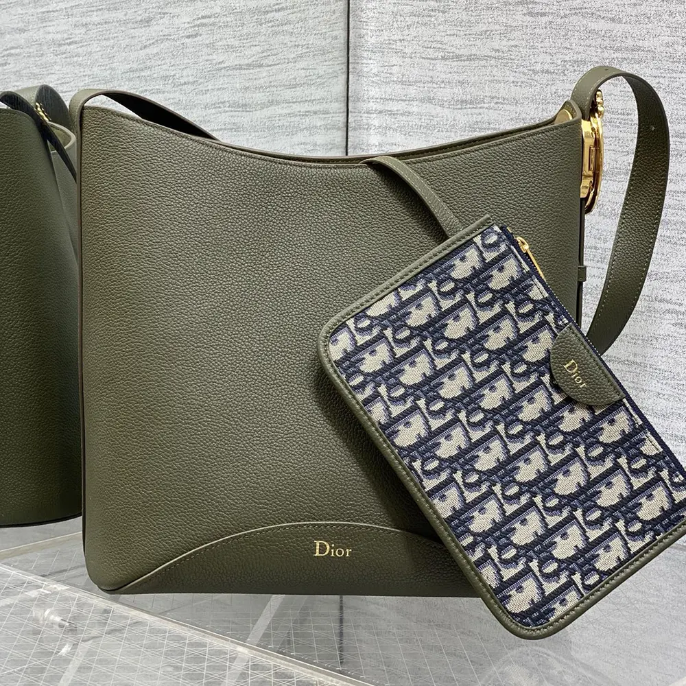 Close-up detail of Médaillon charm on Dior Women Medium Dior Médaillon Bucket Bag
