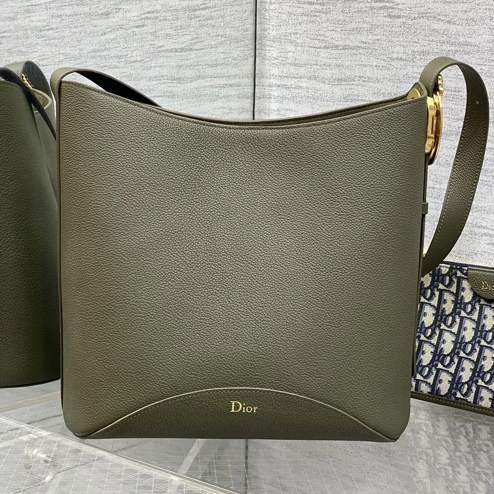 Side angle showing silhouette of Dior Women Medium Dior Médaillon Bucket Bag Khaki Grained Calfskin