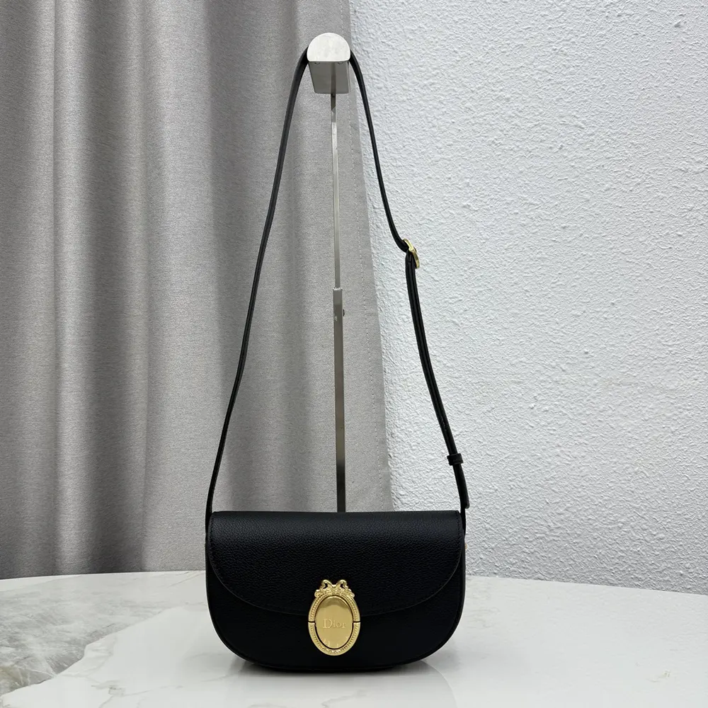 Close-up of silver Dior Médaillon hardware on flap bag