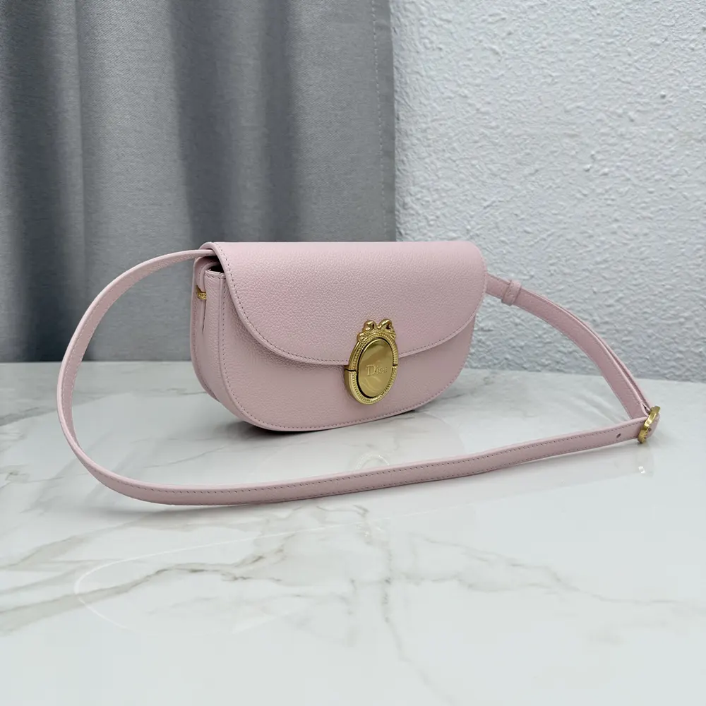 Side angle showing textured grained calfskin of Dior Médaillon bag