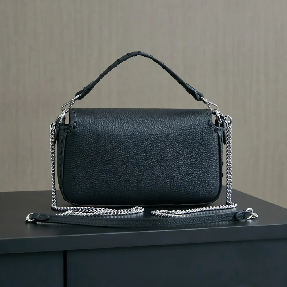 Side angle showing gunmetal hardware on Fendi Women Baguette® Mini Bag