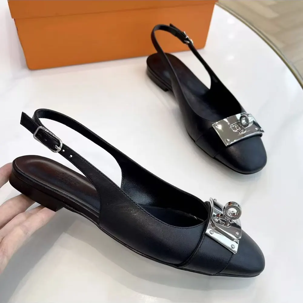 Close-up of gold Kelly buckle detail on Hermes Women Gold Innocente Slingback