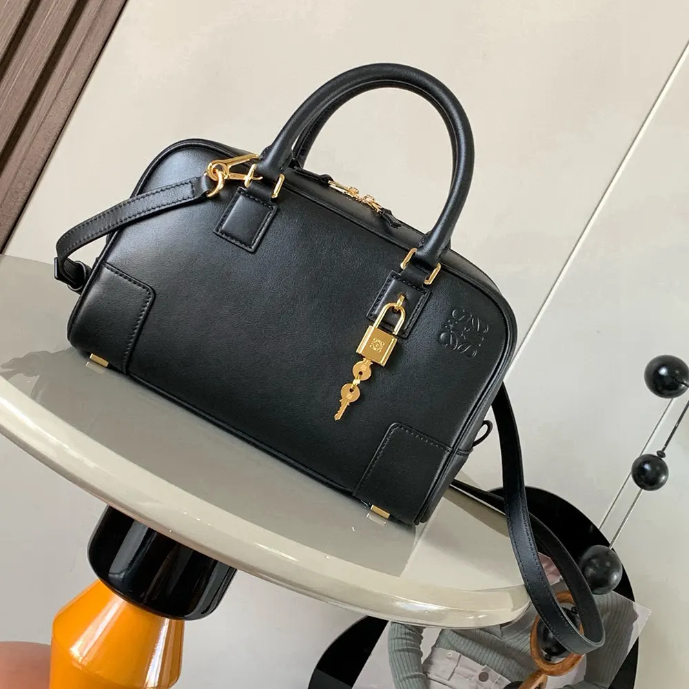 Close-up of magnetic flap closure on Loewe Amazona 23 bag