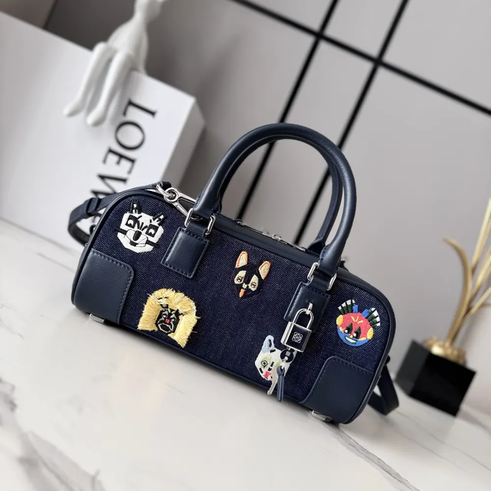 Close-up of embroidered cats detail on Loewe Unisex Amazona 23 bag