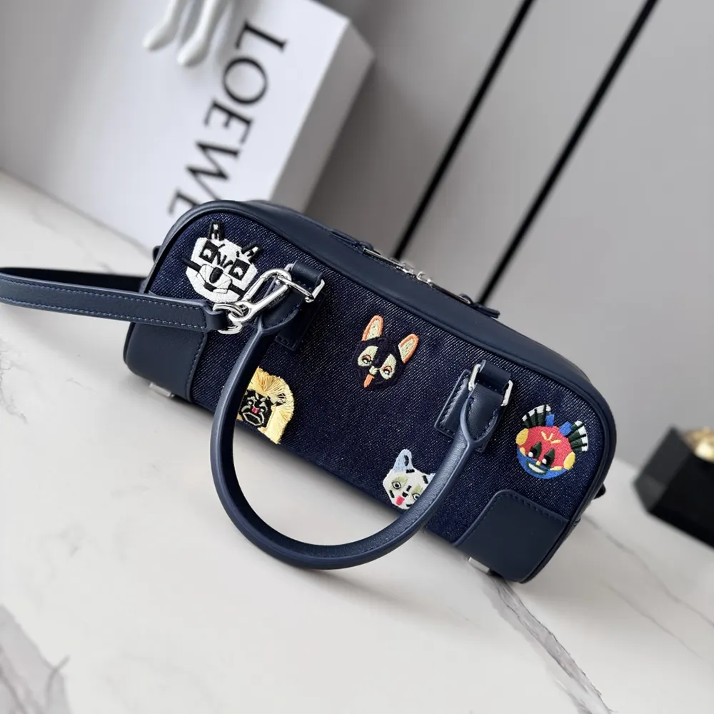 Side angle showing gold-tone hardware on Loewe Unisex Cats Amazona 23 bag