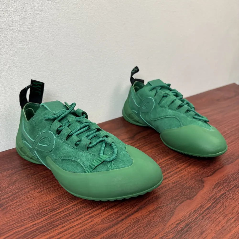 Close-up of jungle green calfskin suede texture on Loewe Unisex Grip Sneaker