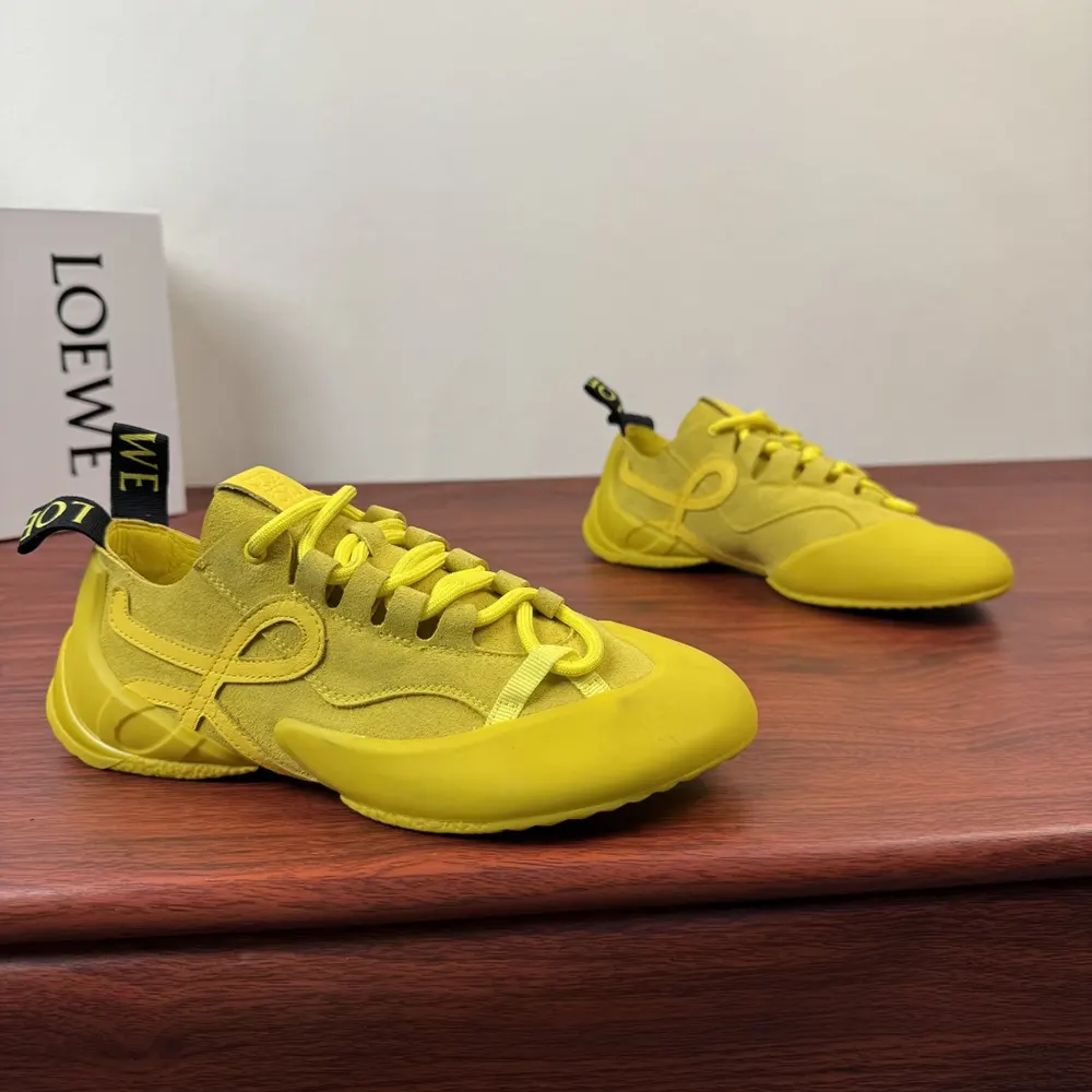 Close-up of embossed Loewe logo on yellow calfskin suede sneaker
